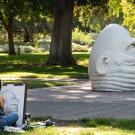 Student sits and sketches Eye on Mrak Egghead.